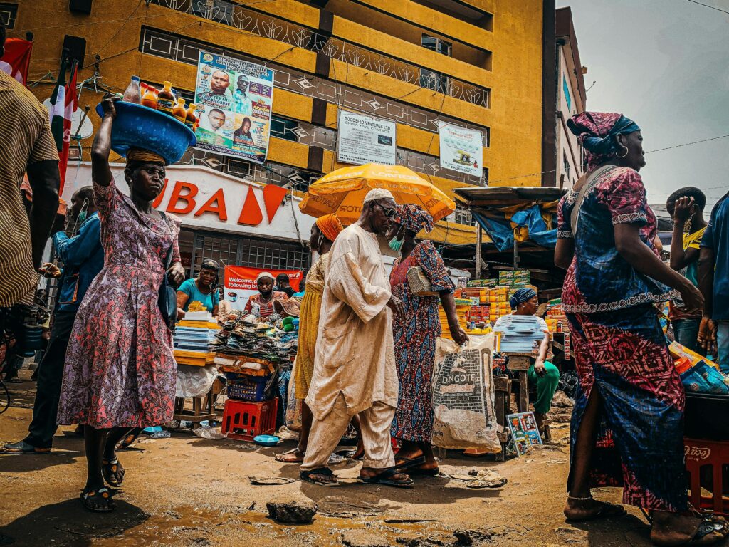 A bustling scene at a vibrant outdoor market in Nigeria, showcasing local culture and daily life.